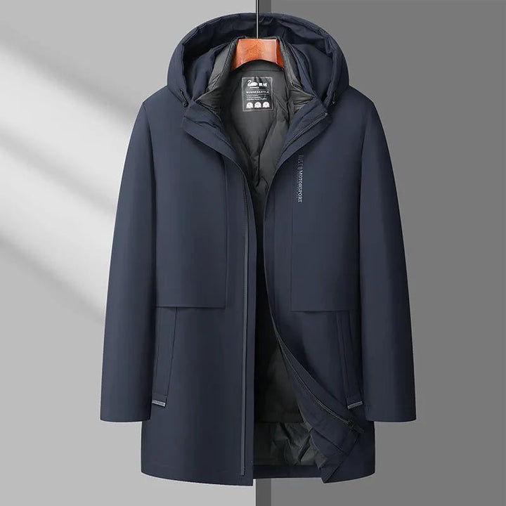 Navy blue coat on a hanger against a gray background